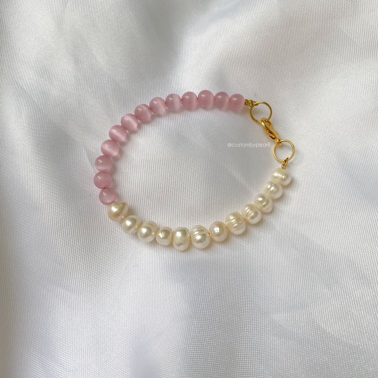 Pulsera Perlas de río y ojo de gato rosa